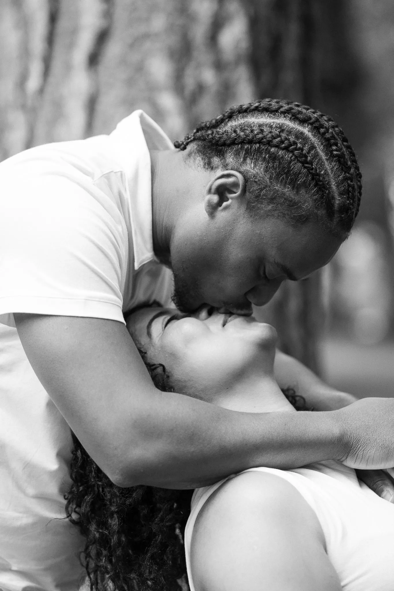 Couple photo, man kissing his girlfriend, black and white photography