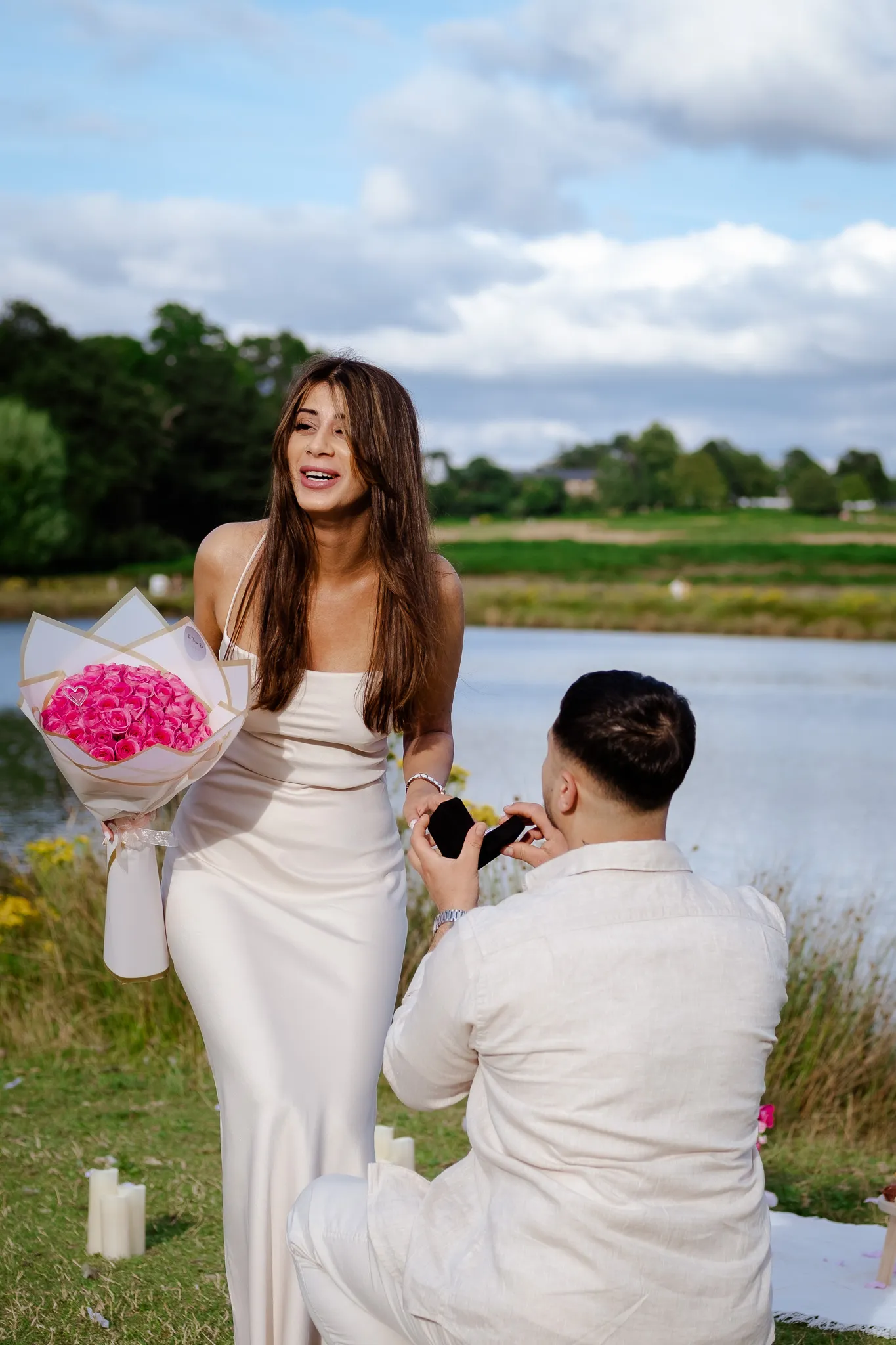Man holding a ring, proposing to his girlfriend