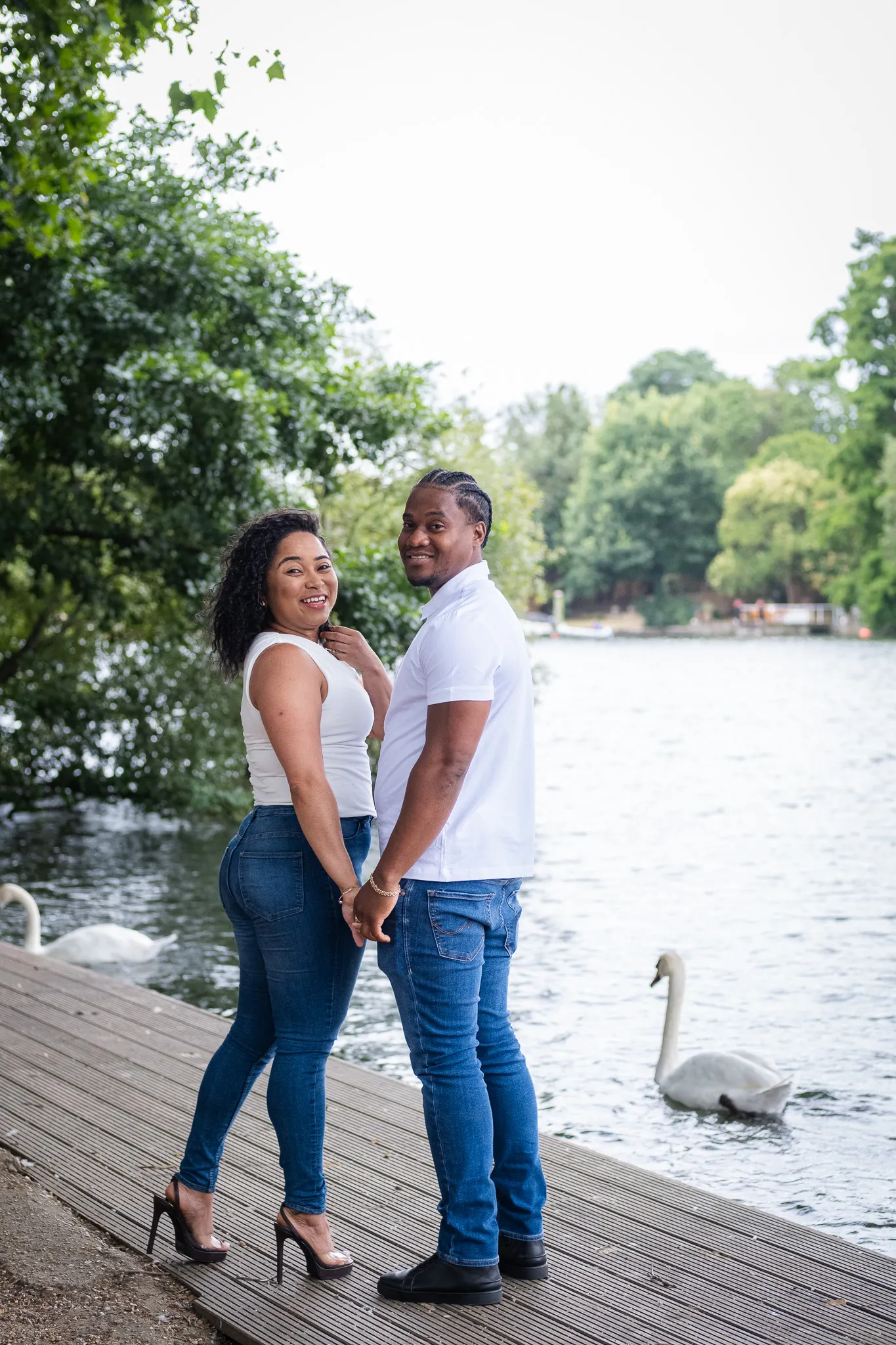 A couple by the river, holding hands