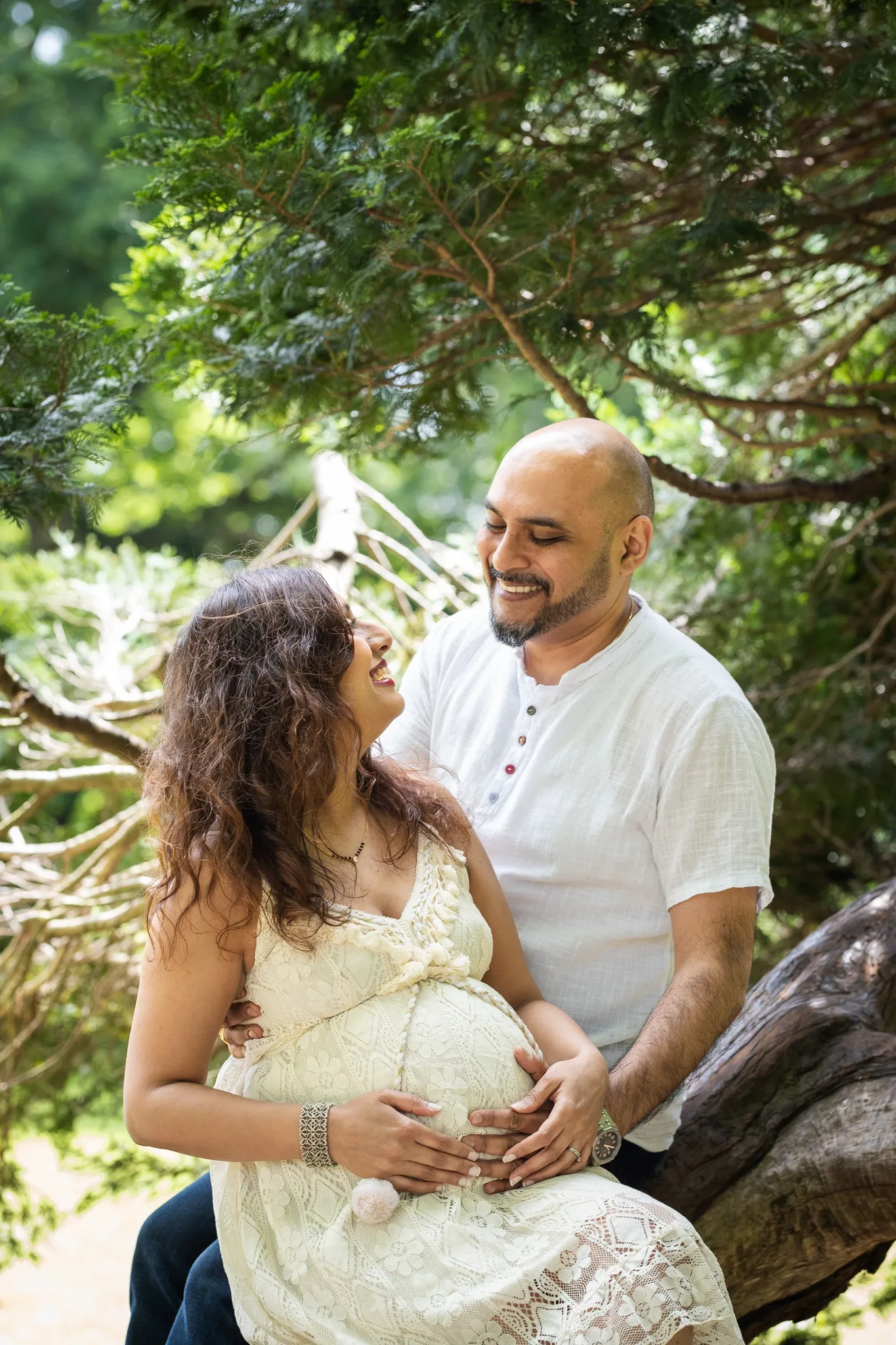 Couple expecting their first child, doing a photoshoot at Canbury gardens in Kingston