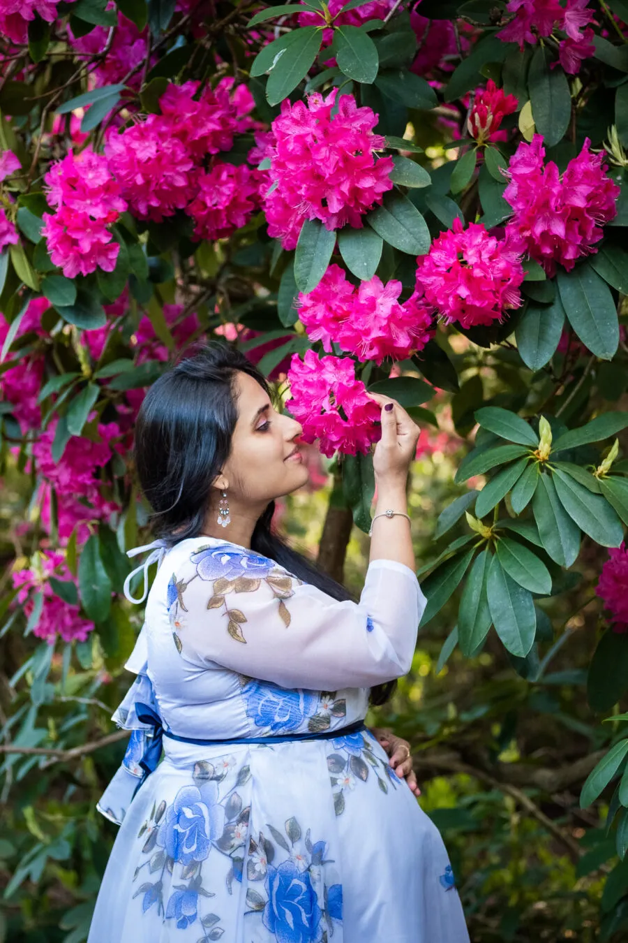 Pregnant woman around flowers at Isabella plantation in Richmond park