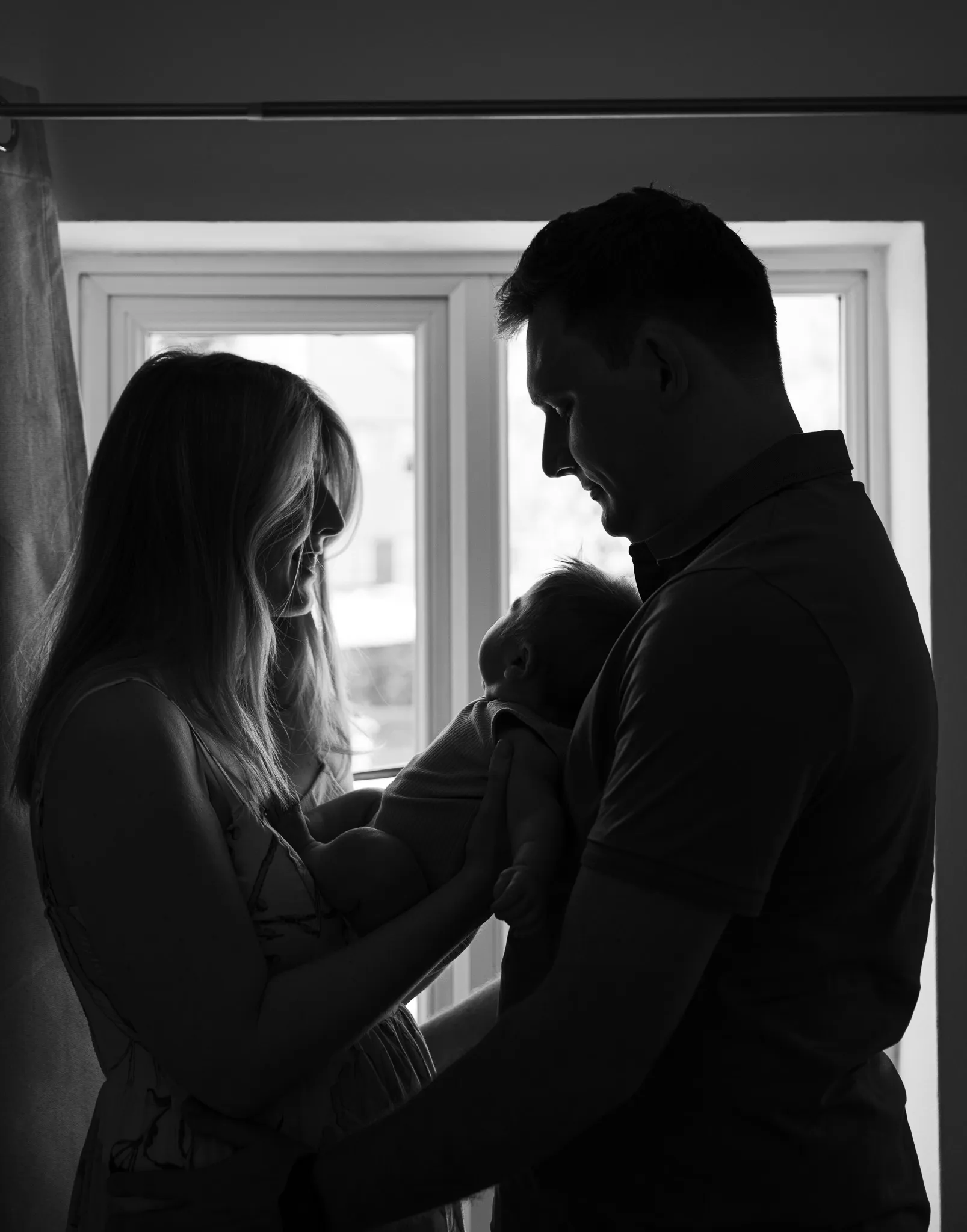 A family laughing together outdoors
