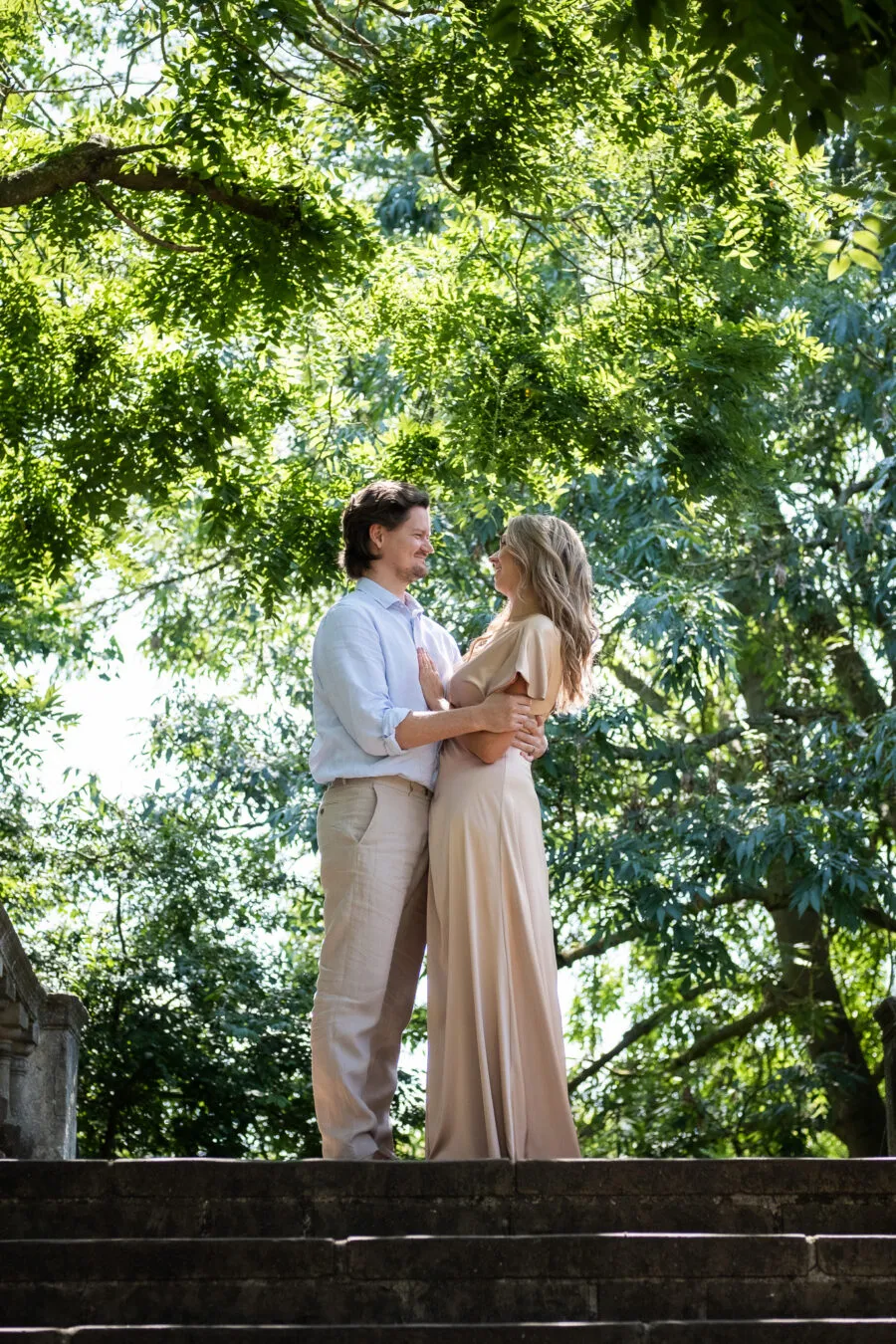 Pre-wedding photoshoot at York House garden, a couple hugging and looking into each other eyes