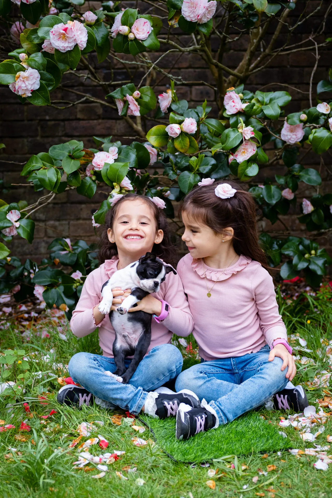 Twin girl with their puppy for outdoor photo session