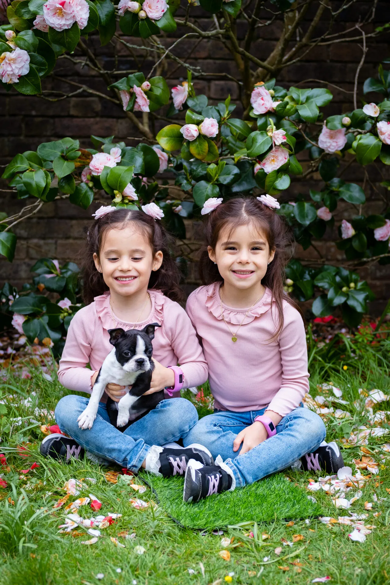 Twin girl with their puppy for outdoor photo session