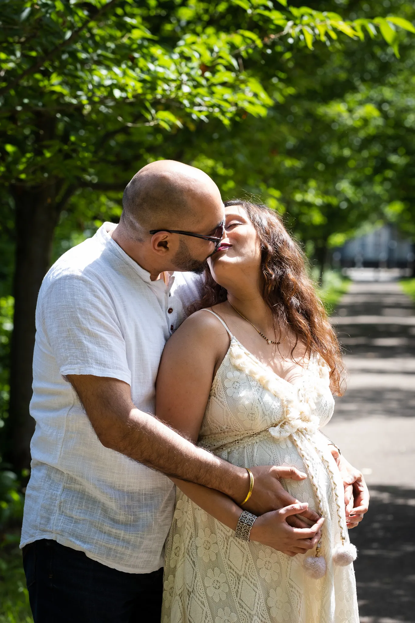 Couple expecting their first child, doing a photoshoot at Canbury gardens in Kingston