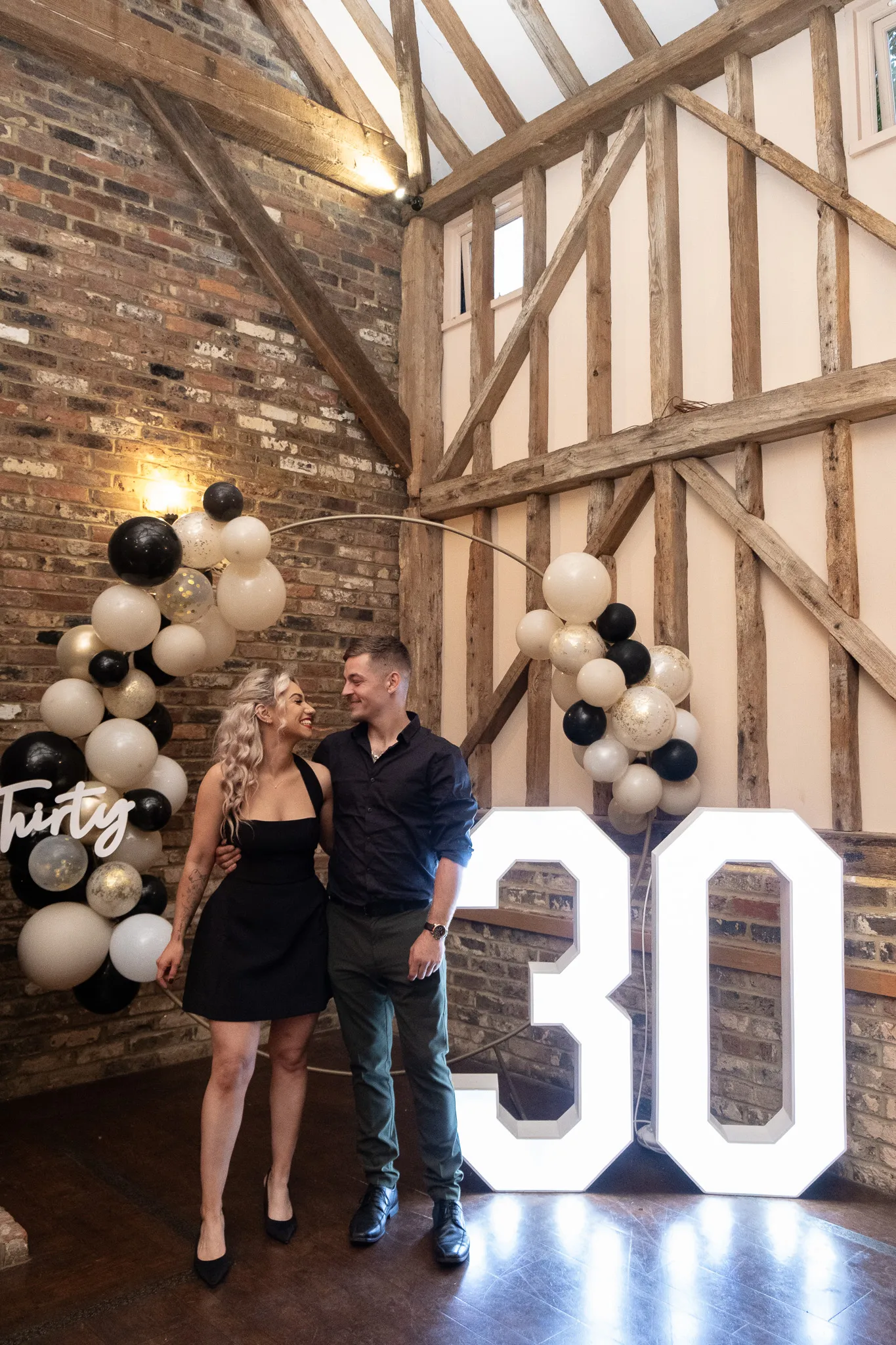 Birthday event, celebrating 30th anniversary, couple celebrating birthday together with family