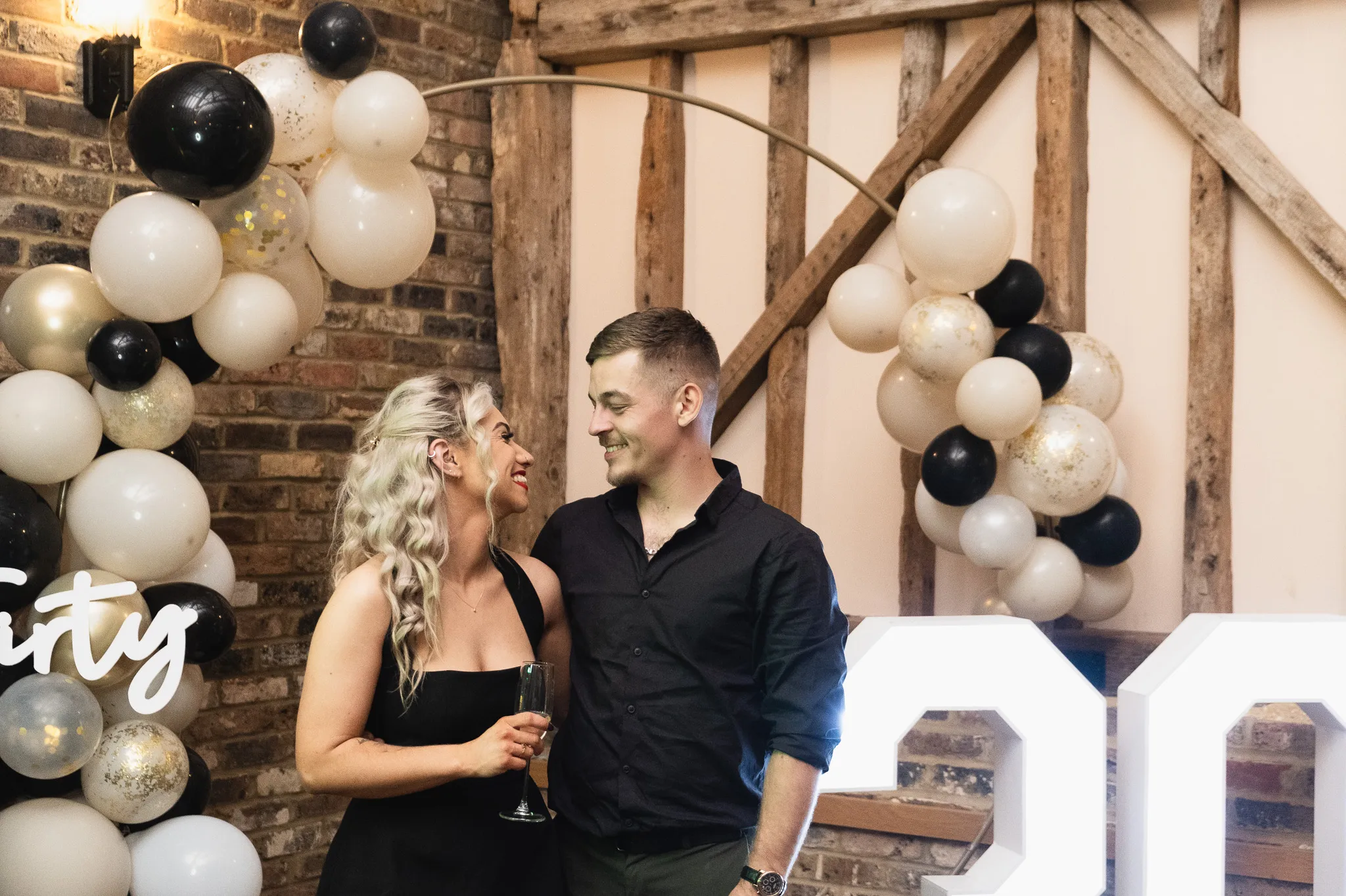 Birthday event, celebrating 30th anniversary, couple celebrating birthday together with family