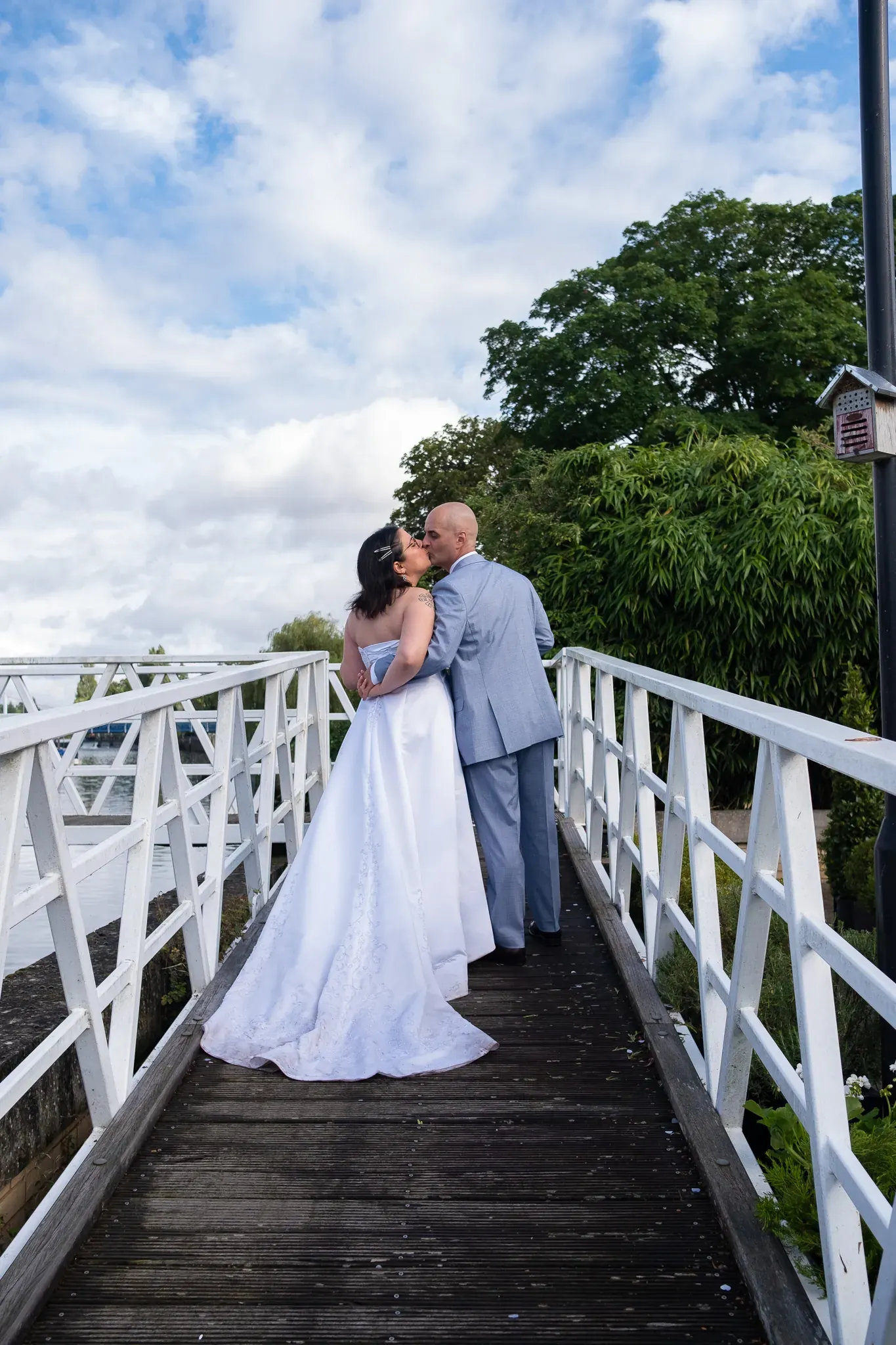 Groom and bride kissing, wedding photoshoot