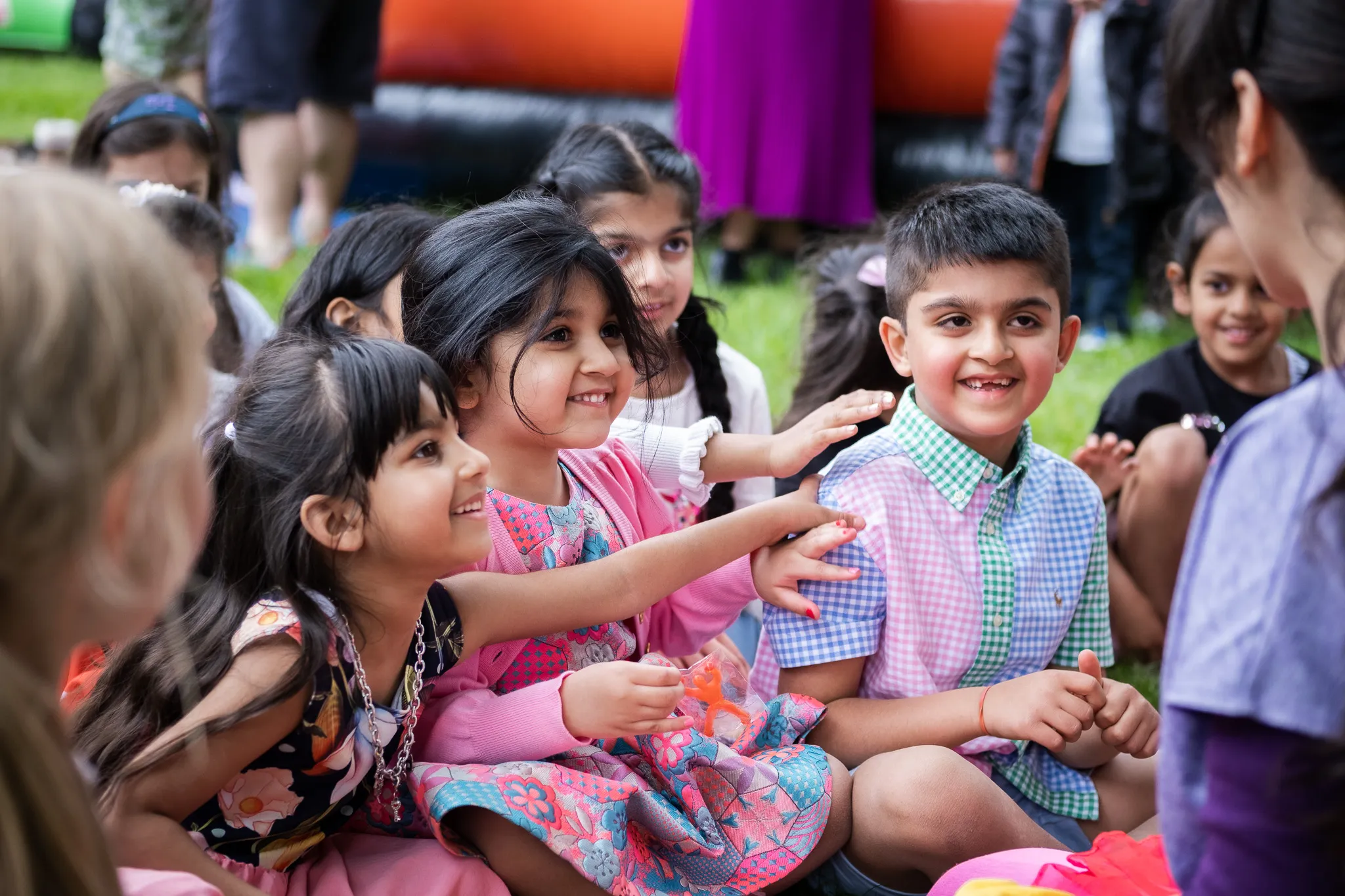 Young children smiling and enjoying a birthday event