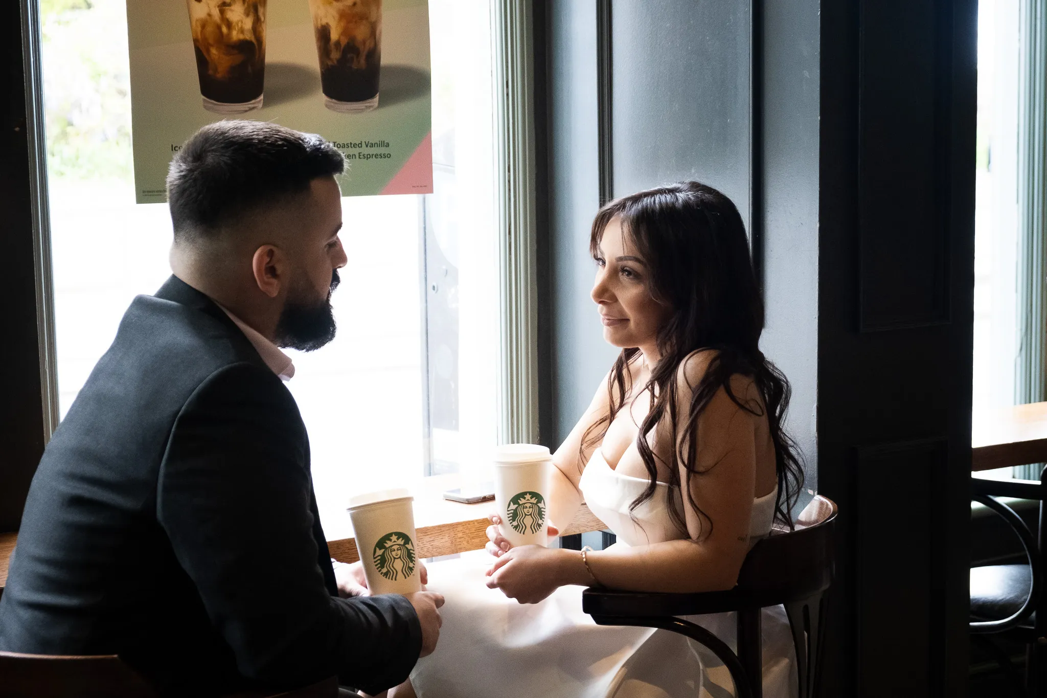 Couple enjoying a romantic moment at a cafe