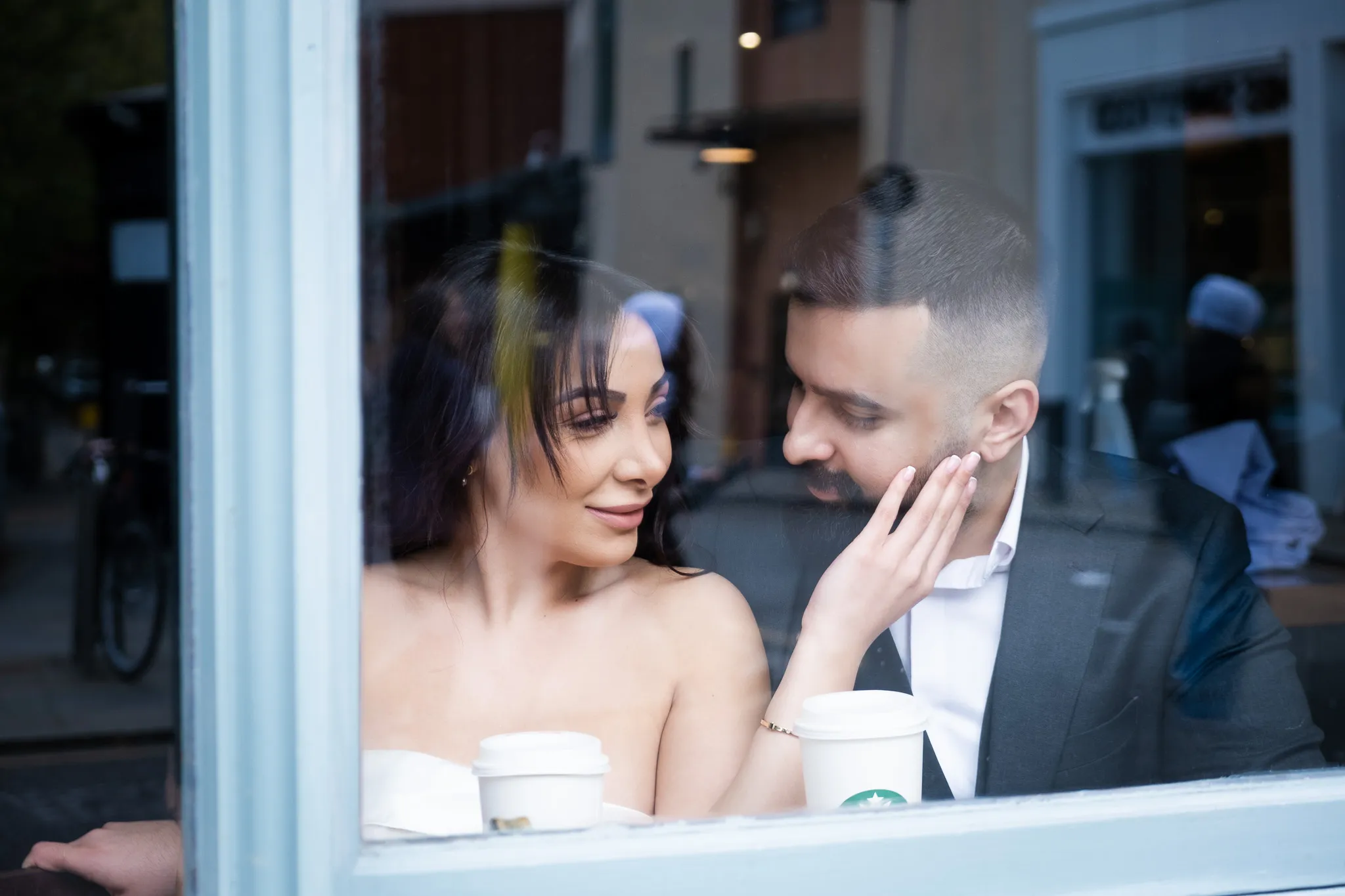Couple enjoying a romantic moment at a cafe