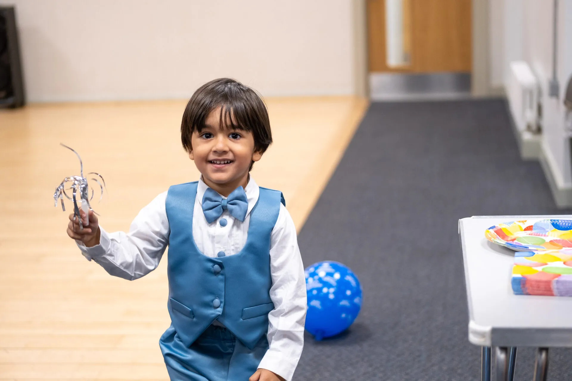 Little boy in a blue costume