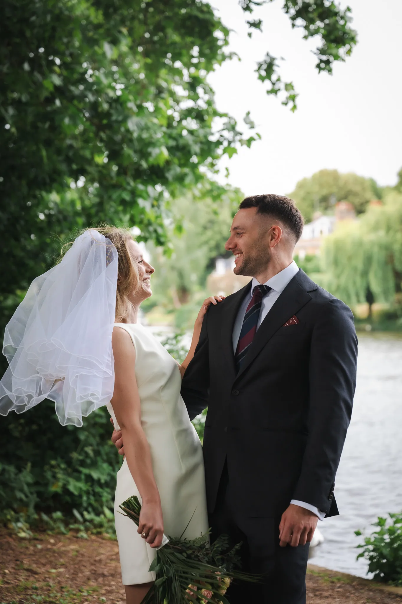 Couple looking at each other by the river
