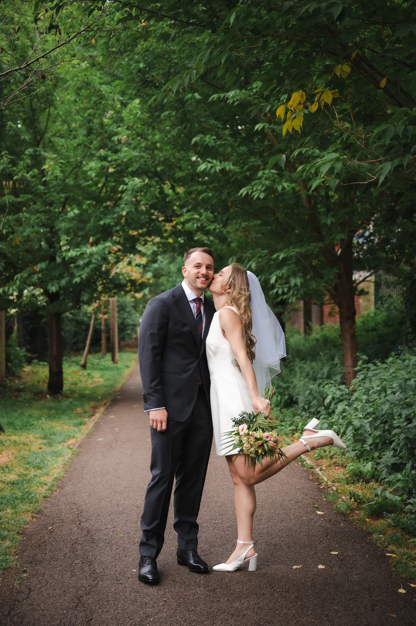Bride kissing her groom on the wedding day