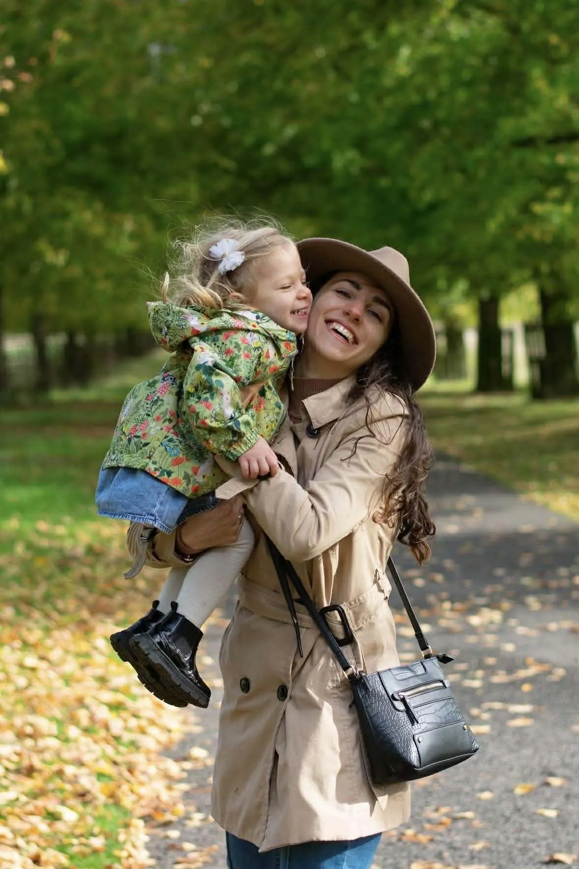 Mother and daughter smiling and hugging each other